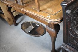An early 20th century oak wind our dining table