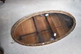 A gilt frame oval wall mirror, approx. 75 x 43cm