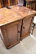 A pair of Victorian mahogany tall bedside cabinets having two internal drawers and shelves , with