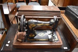 A 19th Century Singer sewing machine (hand crank) in mahogany case