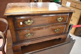 A Titchmarsh and Goodwin or similar nice quality reproduction oak TV cabinet, width approx. 81cm