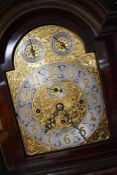 An early 20th Century mahogany long cased musical tubular bell clock having triple weighted