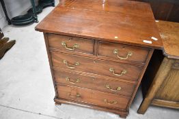 A 19th Century and later dwarf chest of two over three mahogany drawers havung brass drop handles,