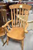 A traditional beech framed country style carver chair