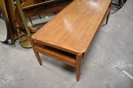 A vintage MCM designer, teak reversible coffee table/bench, probably 1960s, in the style of David