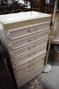 A vintage laminate narrow bedroom chest
