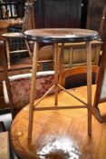 An early 20th Century mahogany occasional three legged table having circular top , diameter 38cm