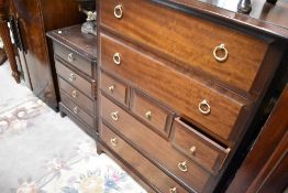 A stag multidrawer bedroom chest and similar set of bedside drawers
