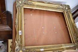 Two gilt frame foliate picture frames, approx frame size 50 x 40 cm, overall size 65 x 55cm