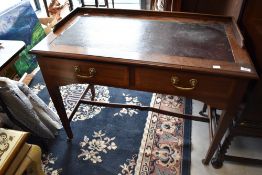An early 20th Century mahogany side table or desk having ledge back, width approx. 98cm
