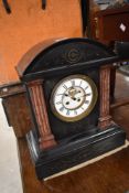 A large Victorian black slate mantel clock