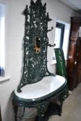 A cast iron verdi gris green cast iron hall stand having marble top, in the 19th Century