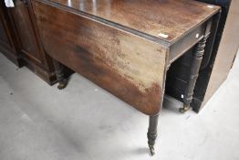 A Victorian mahpgany drop leaf kitchen dining table, restoration needed