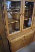 An Ercol Windsor glazed display cabinet, height approx. 183cm, width 91cm