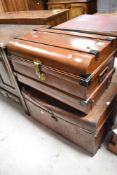 Two vintage tin travel trunks including wood effect