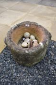 A sandstone plague stone/pot of circular form, probably 17h Century, diameter approx 38, height 32cm