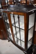 An early 20th Century mahogany china cabinet, on ball and claw feet