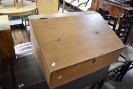 A 19th Century natural pine clerks desk, having internal drawers, width approx. 76cm