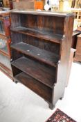 A 19th Century simulated rosewood waterfall bookcase having brass gallery, width approx. 96cm