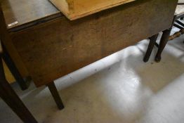 An early 19th Century dining table having narrow top and square gate legs, width approx. 97cm , open