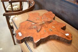 A sectional laquered timber clock having quartz movement and roman numeral dial, approx 55 x 55cm