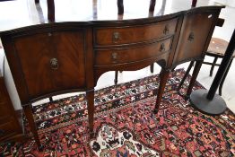 A reproduction Regency serpentine front sideboard