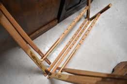 A vintage garment display frame, believed to be a Shetland sweater stretcher (jumper board)