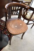 A vintage bentwood dining chair having ply seat with label to base, APM