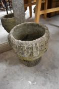 A concrete planter, height approx. 25cm