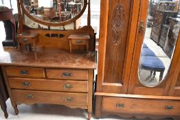 A Victorian mahogany three piece bedroom suite , comprising mirror door wardrobe, dressing table and