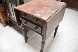 A 19th Century mahogany occasional pembroke style table with double drawer under