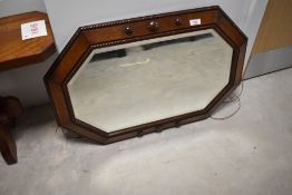 An early 20th Century oak canted wall mirror, approx. 75 x 50cm
