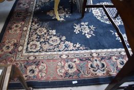 A modern Chinese style carpet square having blue ground , with foliate pattern, approx. 273 x 186cm