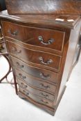 A reproduction Regency style serpentine front narrow chest of six drawers, height approx. 100cm