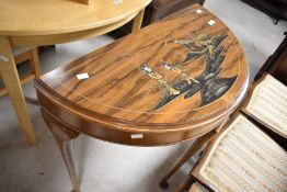 A vintage Japanesque demi lune side table with raised gilt decoration, width approx. 75cm