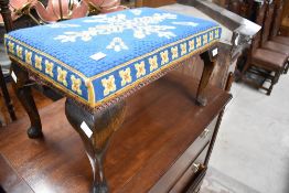 An early to mid 20t Century woolwork footstool