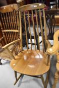 A traditional spindle back rocking chair in the Ercol style