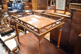A reproduction galleried occasional table