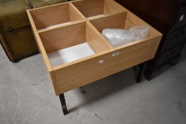 A compartmental play or similar table, approx. 62 x 62cm, height 43cm