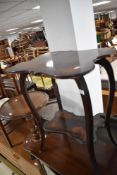 A Victorian stained frame occasional table having foliate decoration