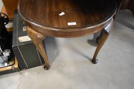 An early 20th Century mahogany coffee table having circular top and cabriole legs, diameter
