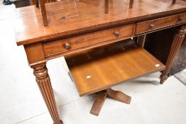 A 19th Century mahogany Regency design buffet/side table having two drawers and reeded tapering legs