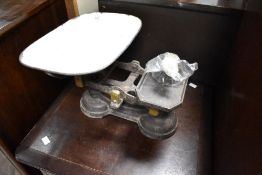 A set of vintage cast iron balance scales