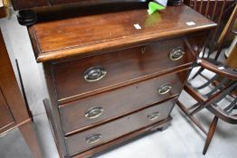 A 19th Century mahogany chest of three long drawers, having Regency style handles and bracket