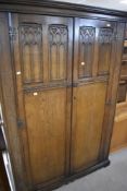 A Priory style oak wardobe, width approx. 126cm