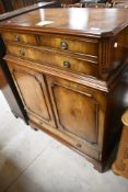 A reproduction Regency style TV cabinet
