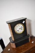 A Victorian black and rouge marble mantel clock , having enamelled face with Roman numeral dial