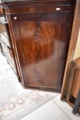 A 19th Century mahogany corner wall cupboard, height approx. 136cm
