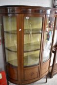 An Edwardian mahogany and inlaid bow fronted display cabinet on square tapered legs , width