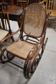A bentwood and canework rocking chair